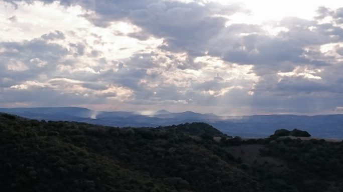 Sun beams over the hills